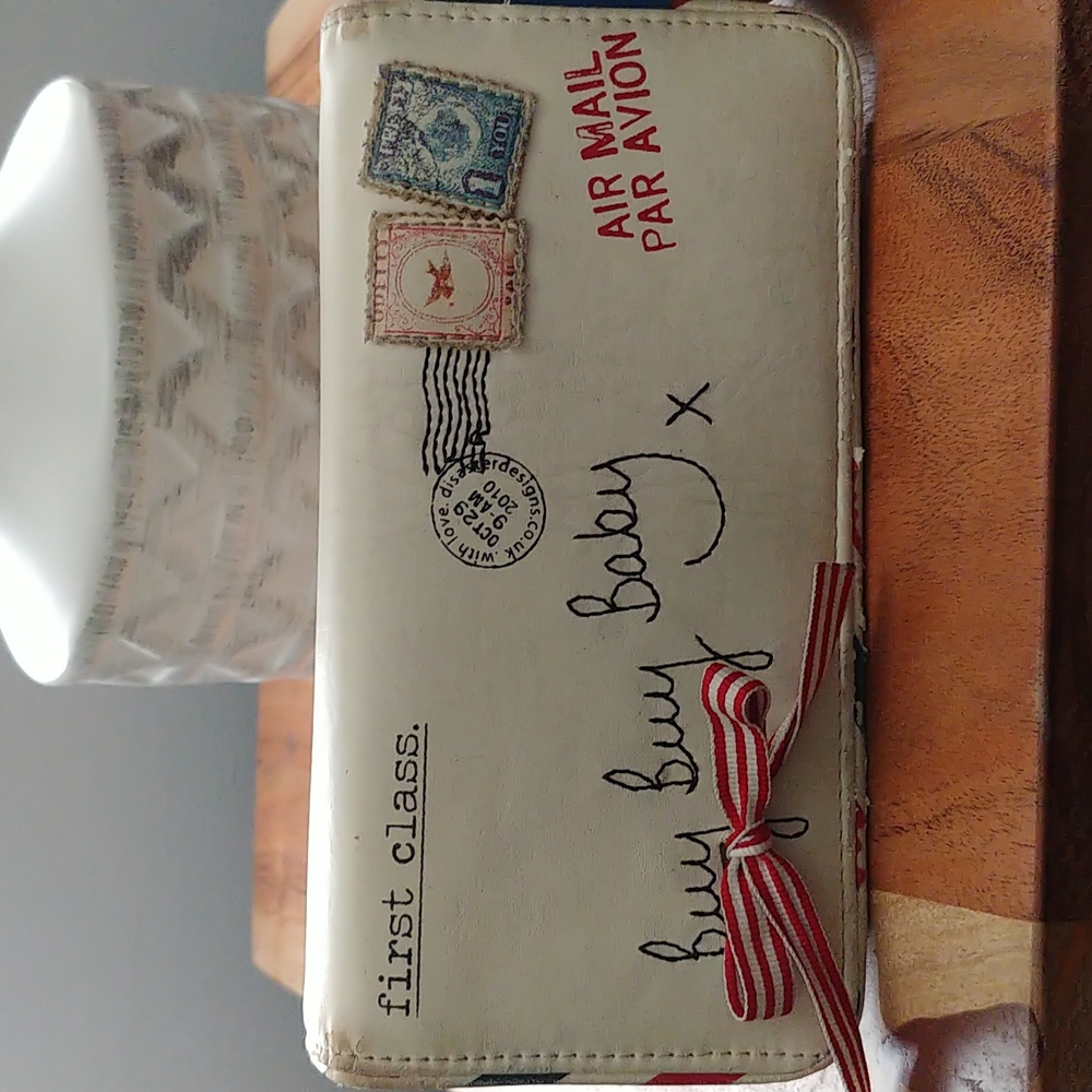Traveler wallet by house of disaster , paper plane BUY BUY BABY.